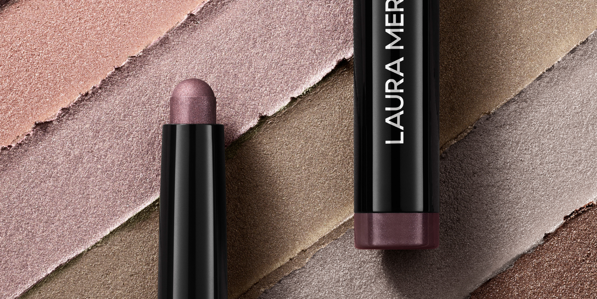 Close up image of Caviar Stick Eye Shadow on top of swatches