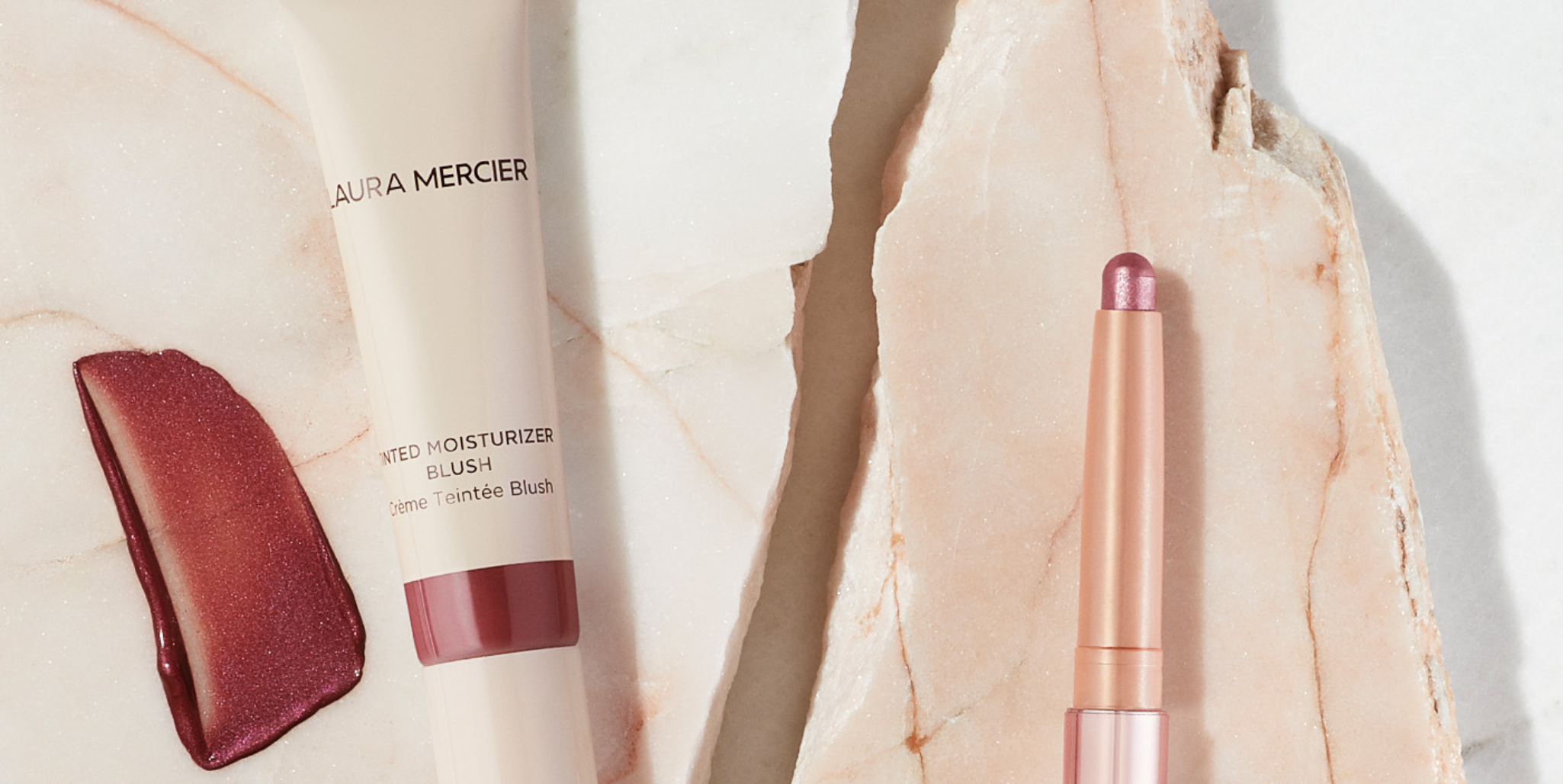 Close up image of Laura Mercier's Tinted Moisturizer Blush & RoseGlow Caviar Stick Eye Shadow
